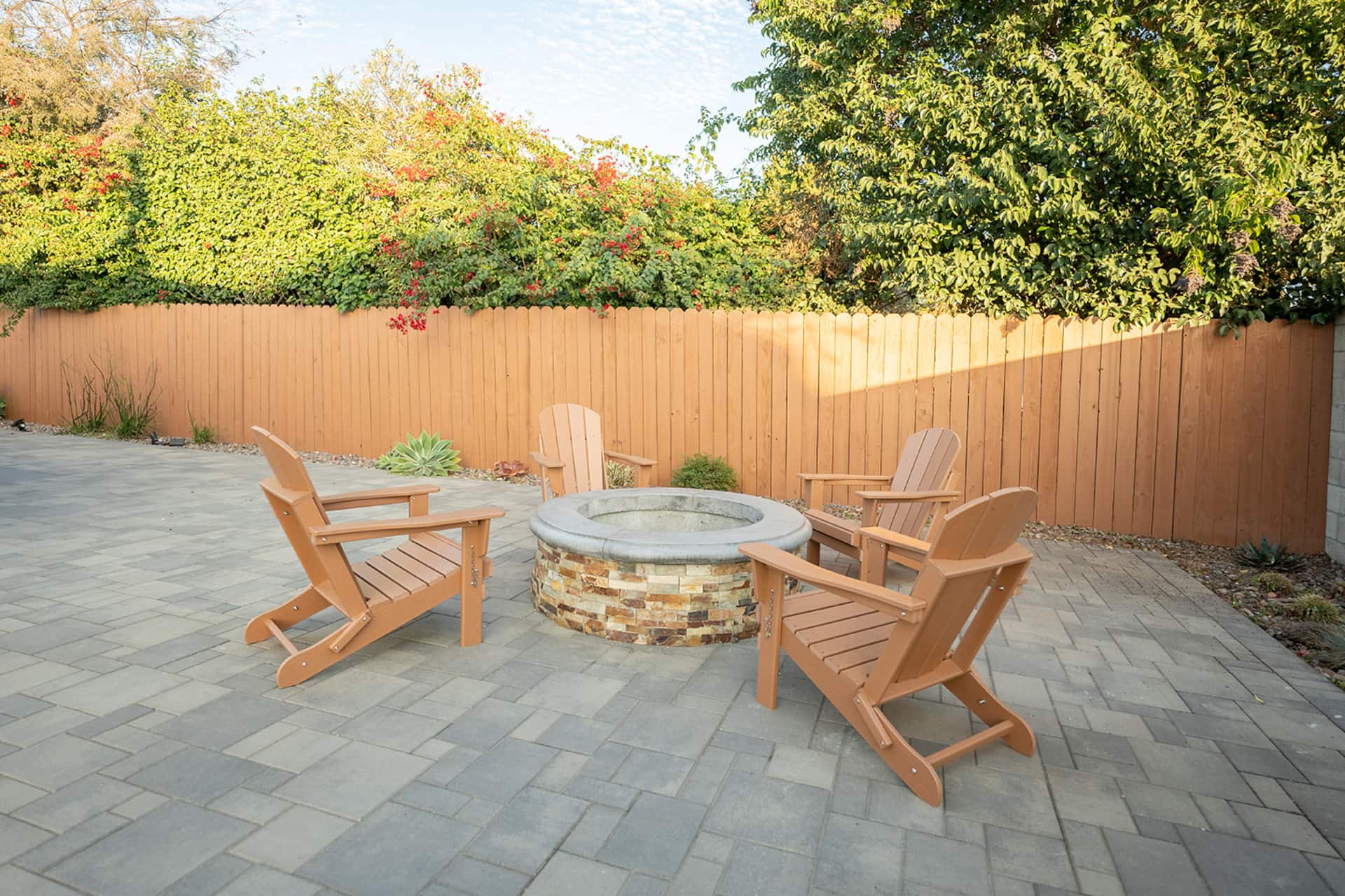 Paver patio with fire pit and adirondack chairs at the Anaheim Disneyland Retreat