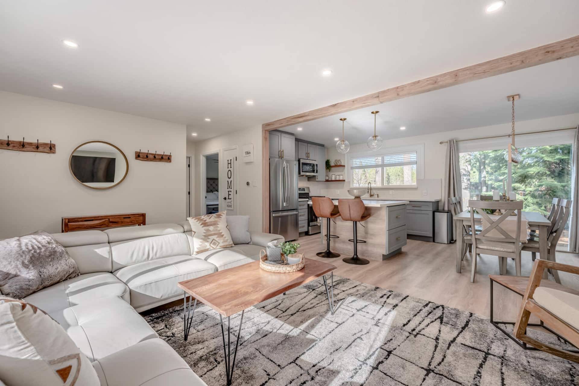 Bright great room with living, kitchen, and dining at the South Lake Tahoe home